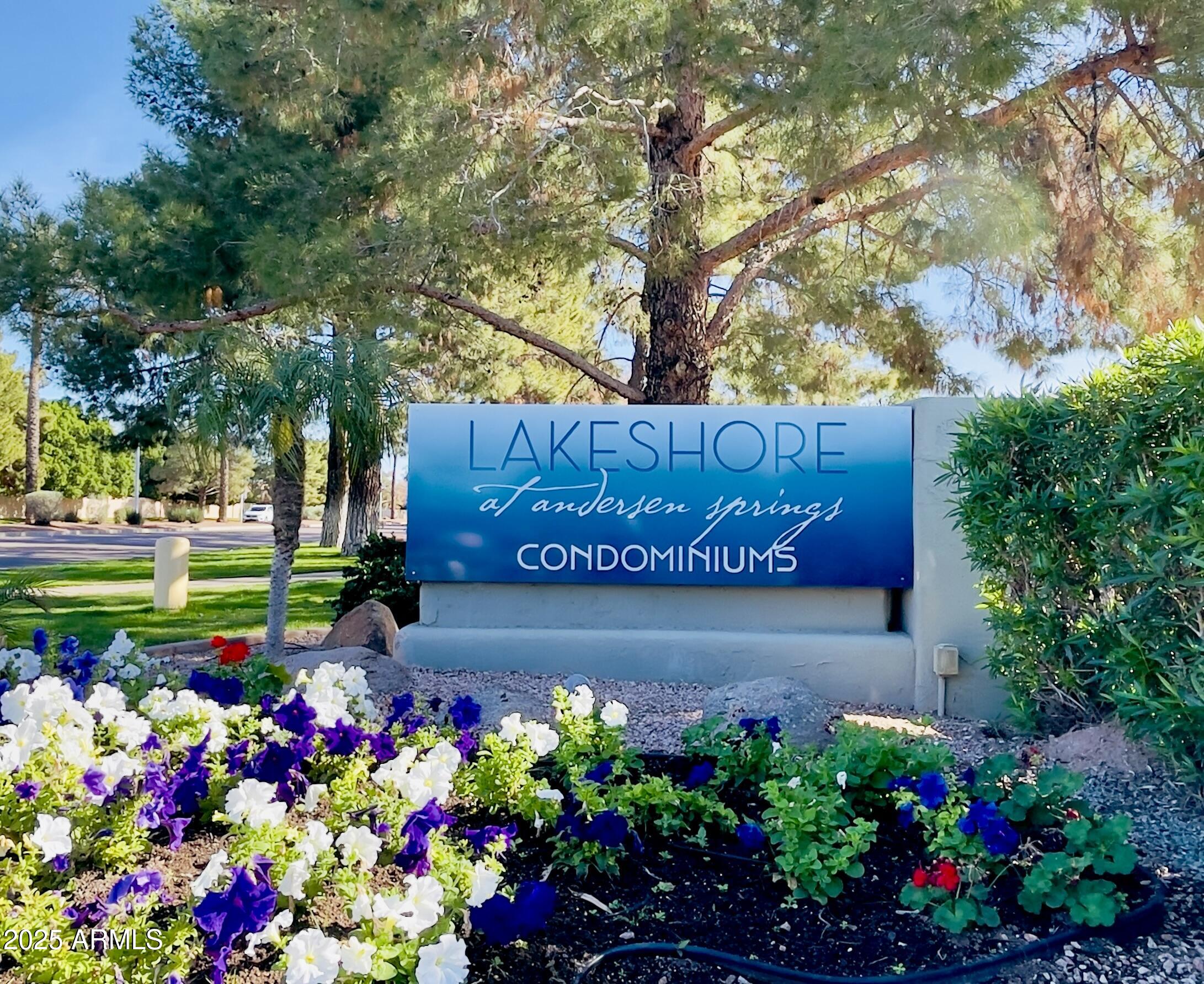 1825 West Ray Road, Unit 2145 Chandler, AZ 85224 - Photo 21 of 25 a sign that is in front of flowers