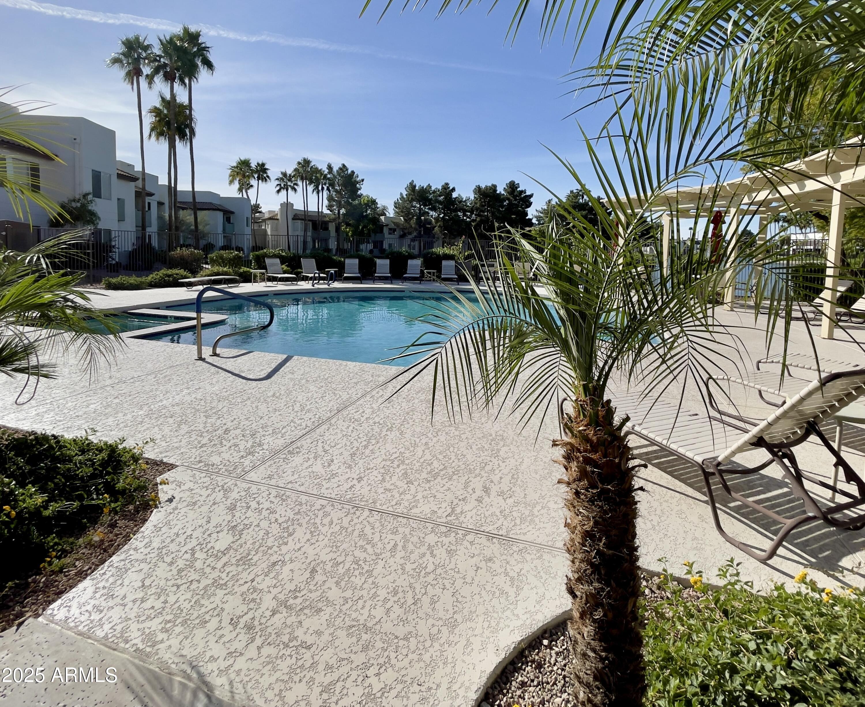 1825 West Ray Road, Unit 2145 Chandler, AZ 85224 - Photo 22 of 25 a view of swimming pool with chairs