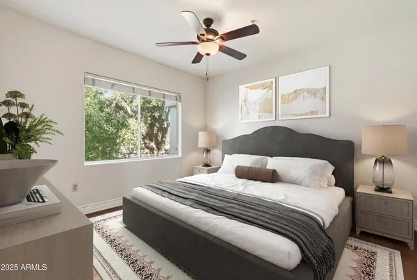 a bedroom with a bed and a window