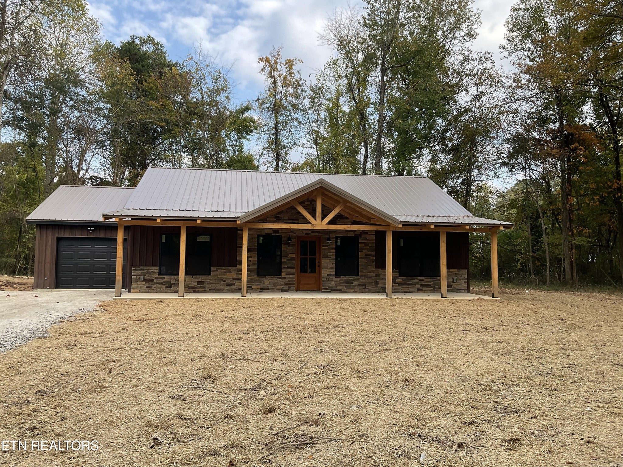 246 Burkemill Road Rockwood, TN 37854 - Photo 1 of 24 a front view of a house with a yard