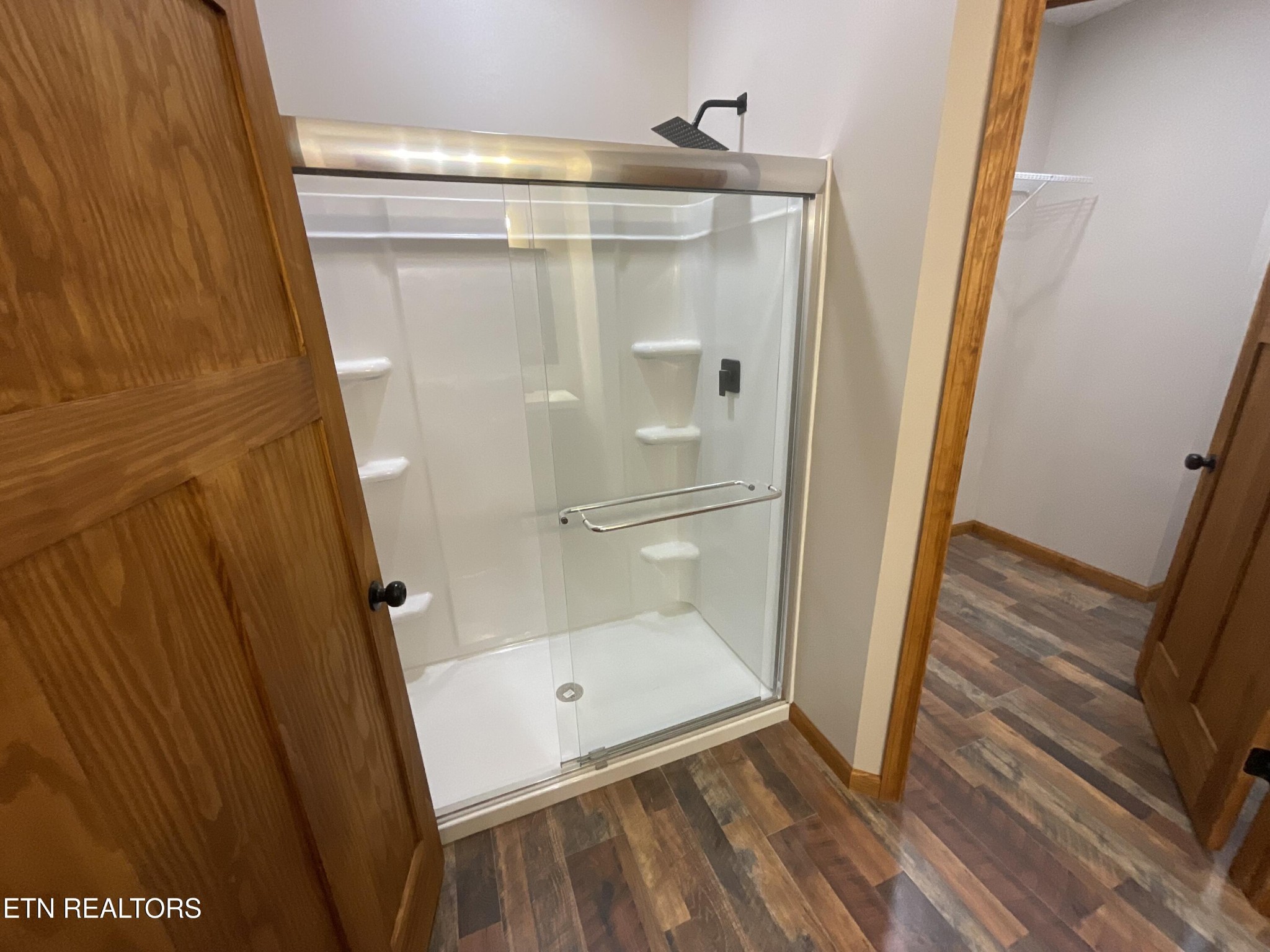 246 Burkemill Road Rockwood, TN 37854 - Photo 11 of 24 a bathroom with a glass door shower