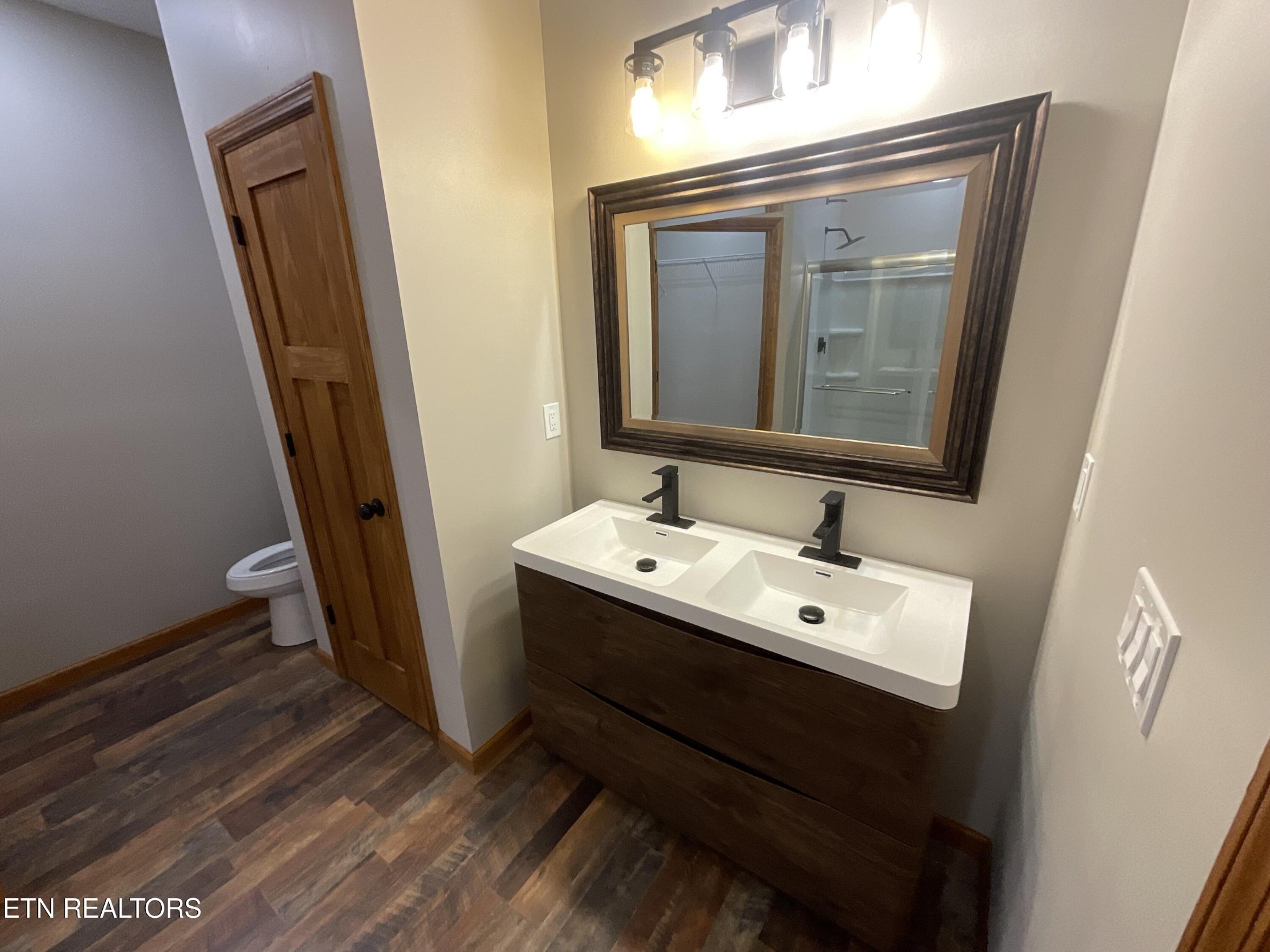 246 Burkemill Road Rockwood, TN 37854 - Photo 12 of 24 a bathroom with a sink a mirror and a vanity