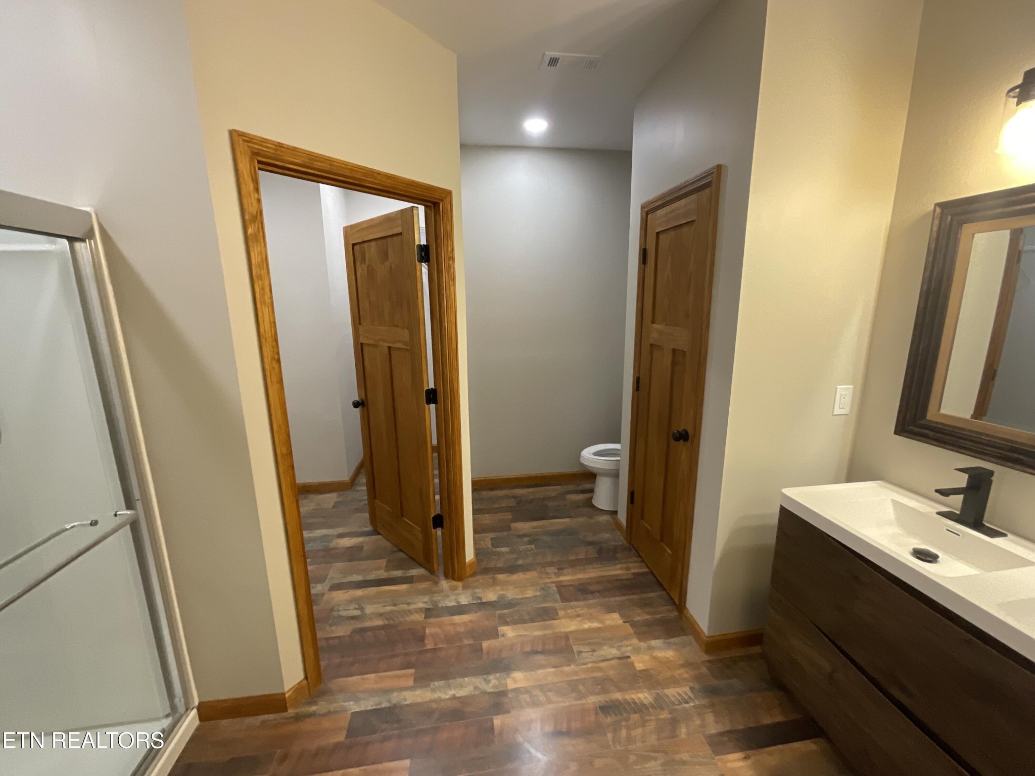 246 Burkemill Road Rockwood, TN 37854 - Photo 19 of 24 a bathroom with sink a mirror and a shower