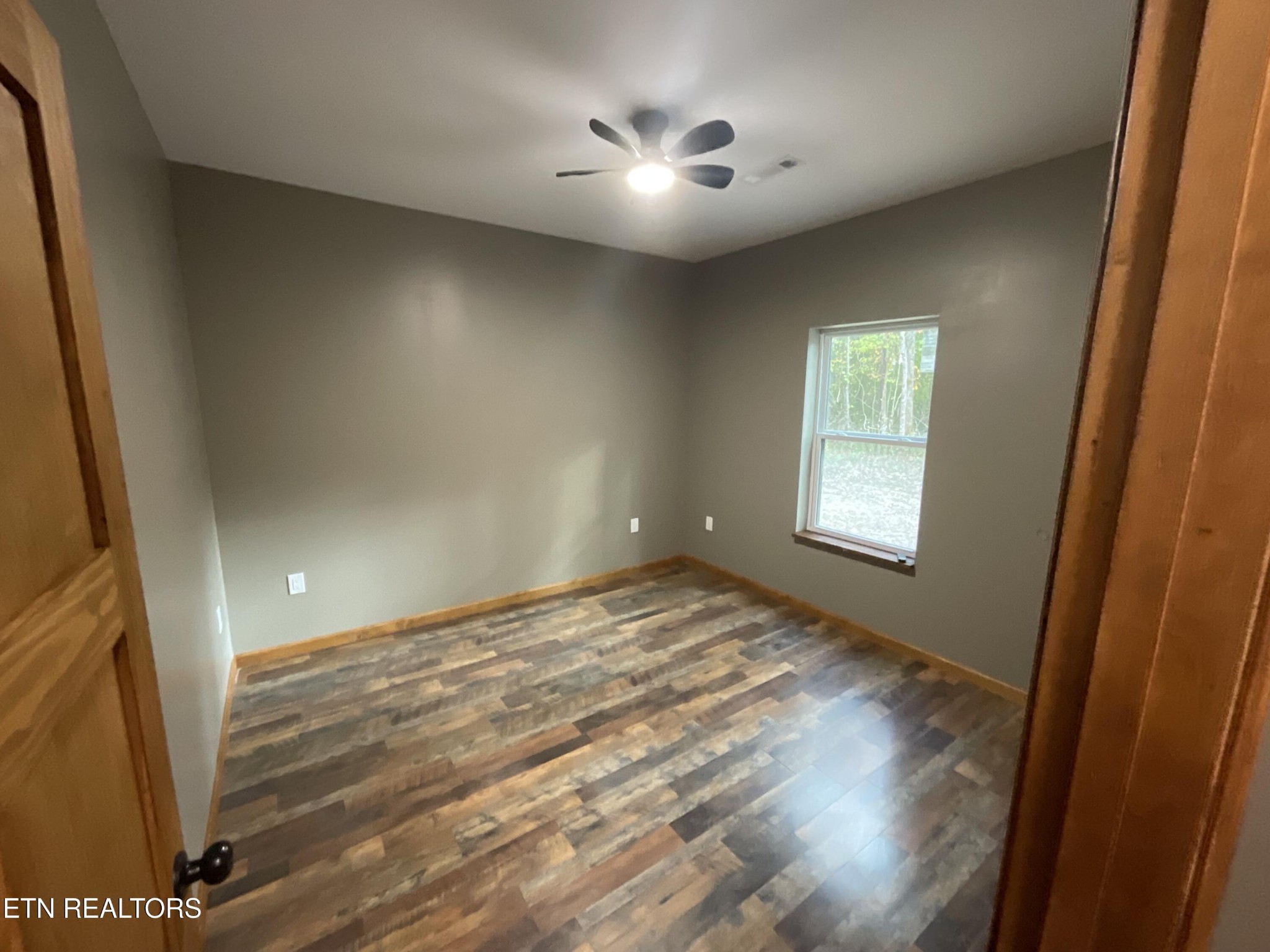 246 Burkemill Road Rockwood, TN 37854 - Photo 4 of 24 a view of an empty room and window