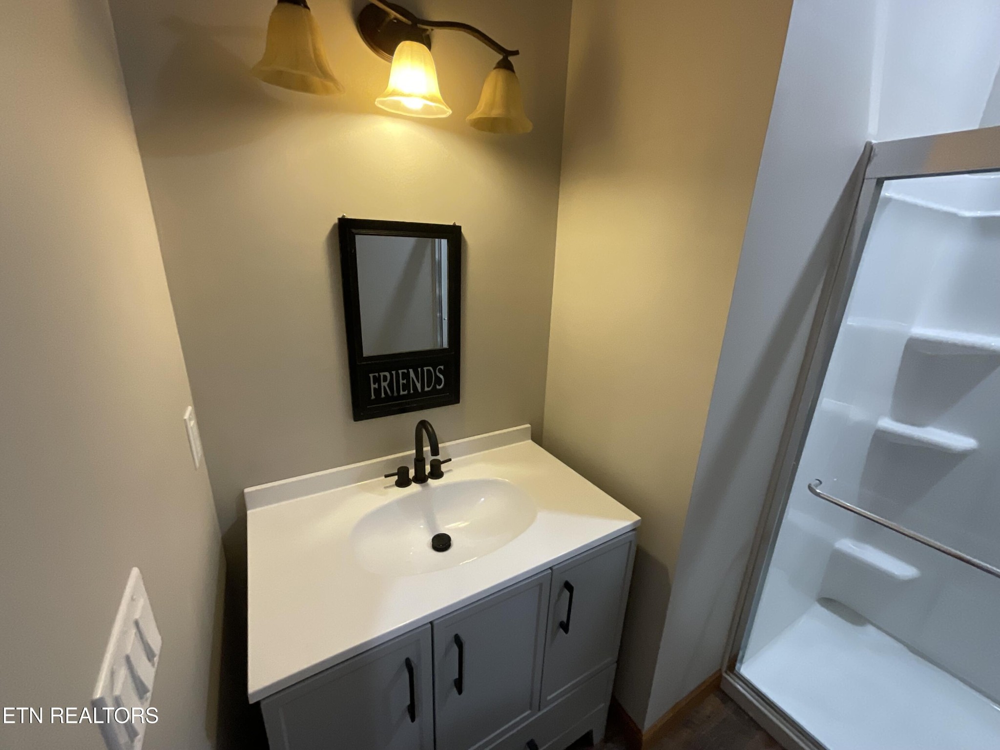 246 Burkemill Road Rockwood, TN 37854 - Photo 6 of 24 a bathroom with a sink and mirror