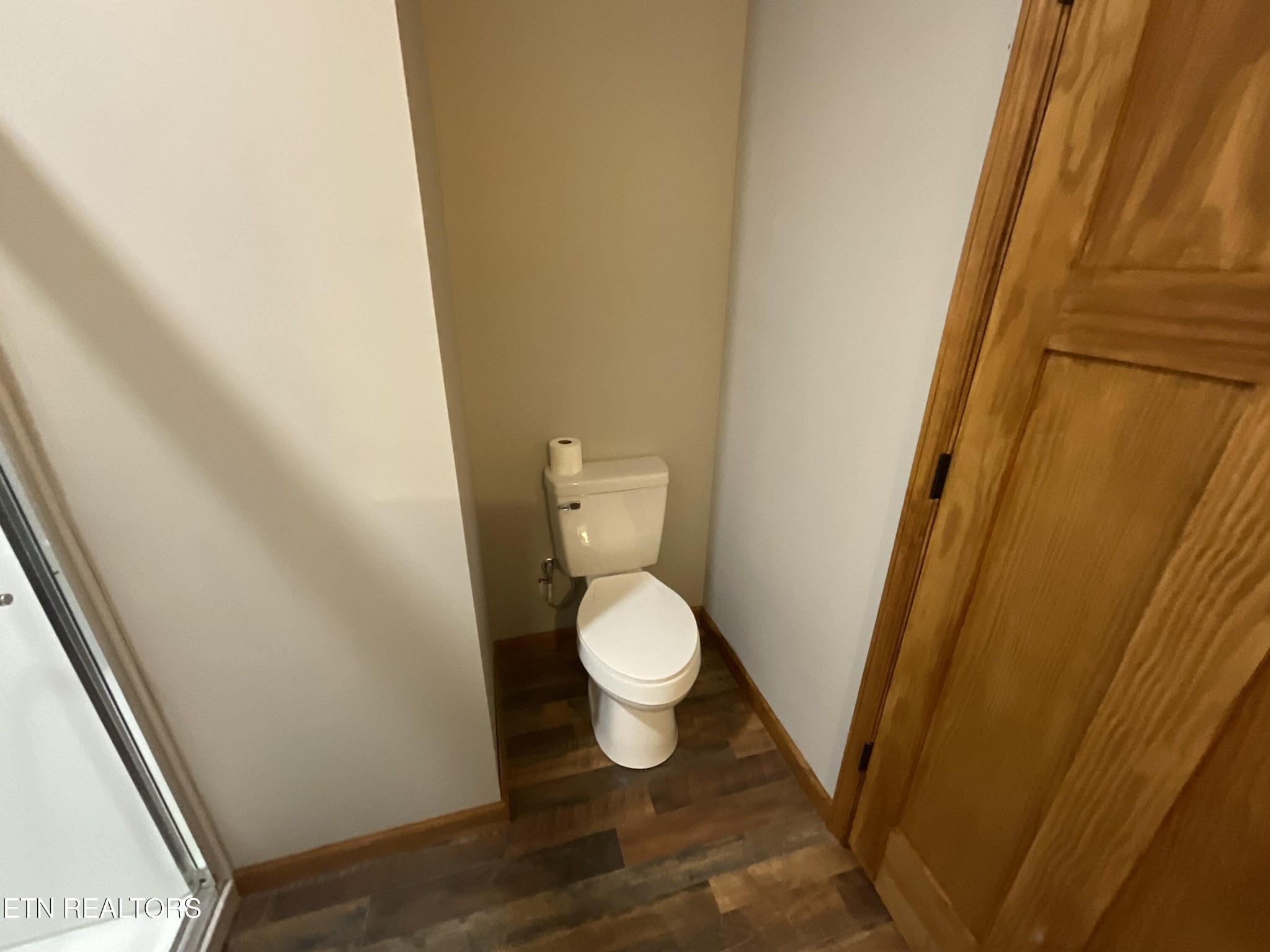 246 Burkemill Road Rockwood, TN 37854 - Photo 7 of 24 a white toilet sitting next to a sink