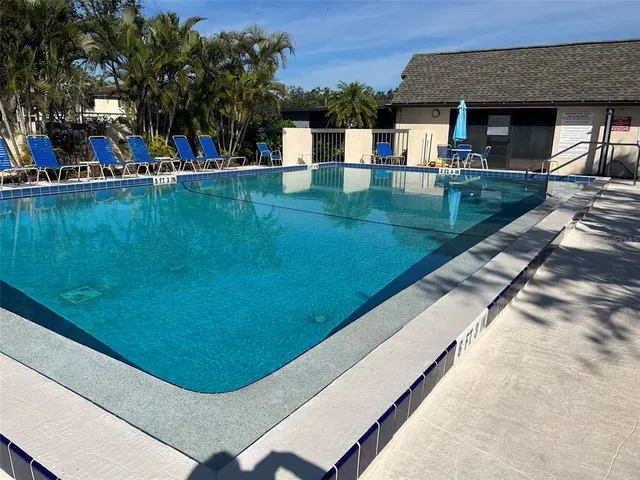 a view of a swimming pool with a patio