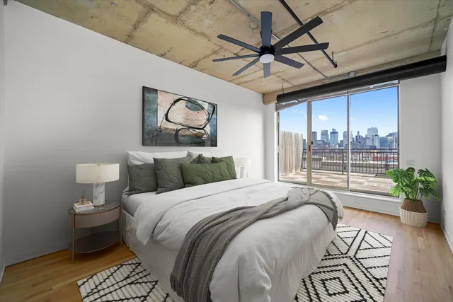 a bed sitting in a bedroom next to a window