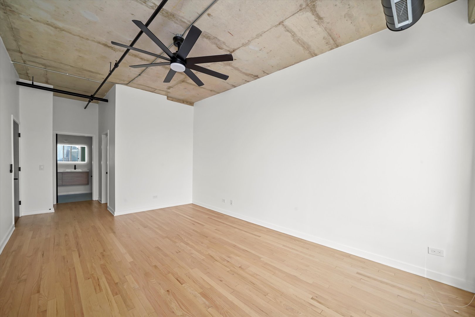 6 South Laflin Street, Unit 910 Chicago, IL 60607 - Photo 13 of 23 a view of a room with wooden floor