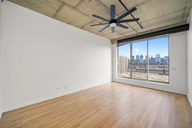 a view of a room with wooden floor and roof