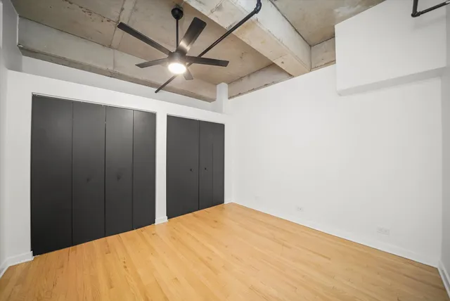 a view of a big room with a ceiling fan