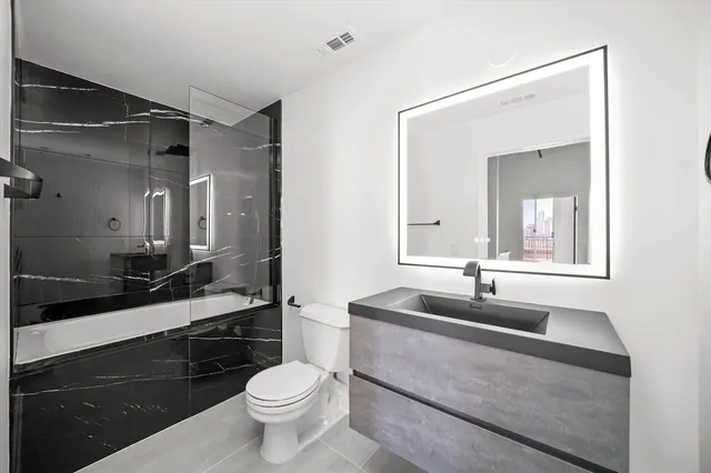 a bathroom with a sink and a toilet