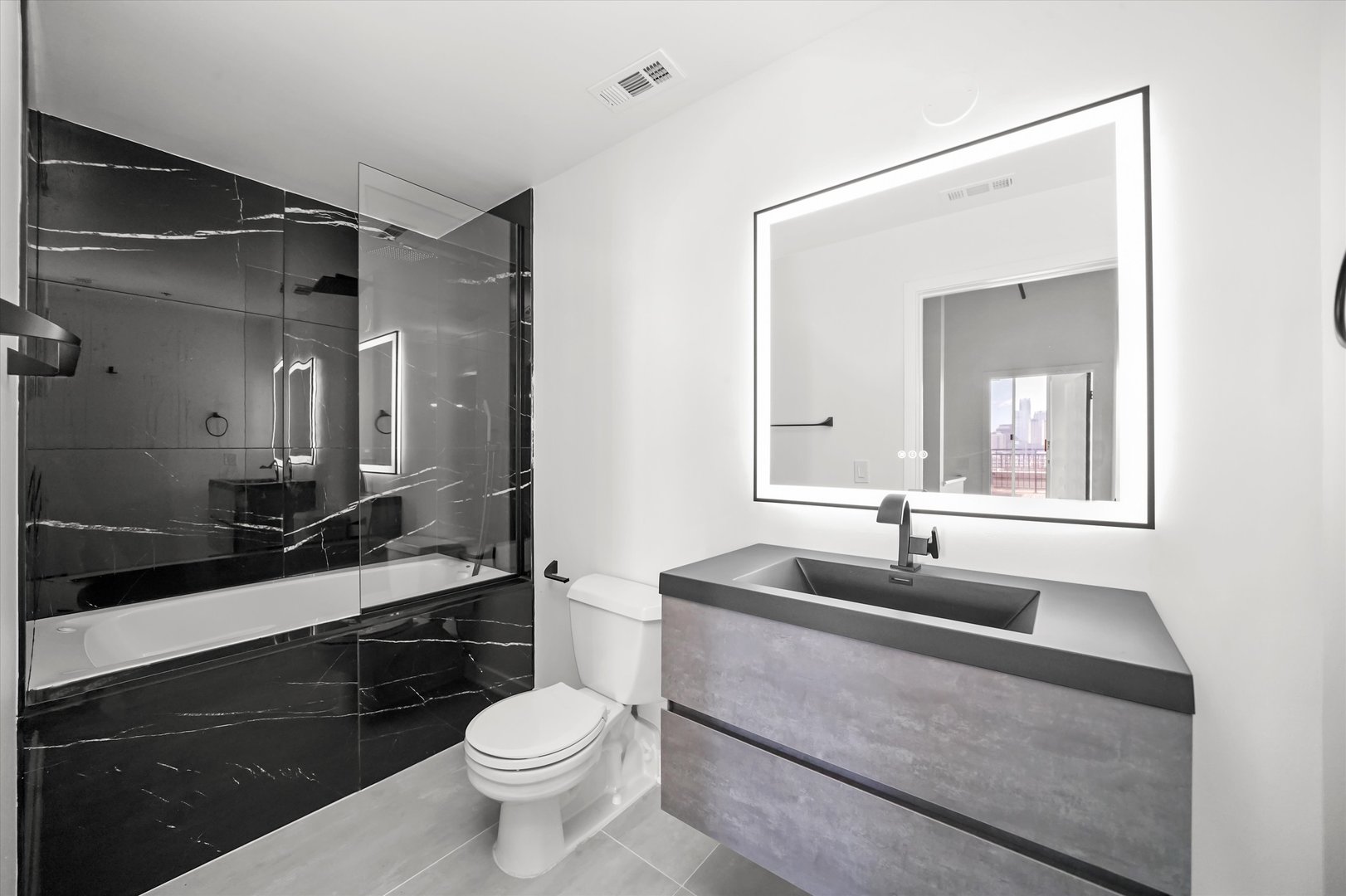 6 South Laflin Street, Unit 910 Chicago, IL 60607 - Photo 20 of 23 a bathroom with a sink and a toilet