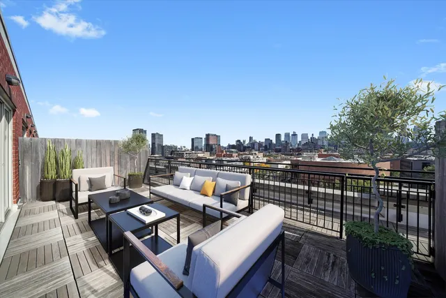 a view of a terrace with furniture