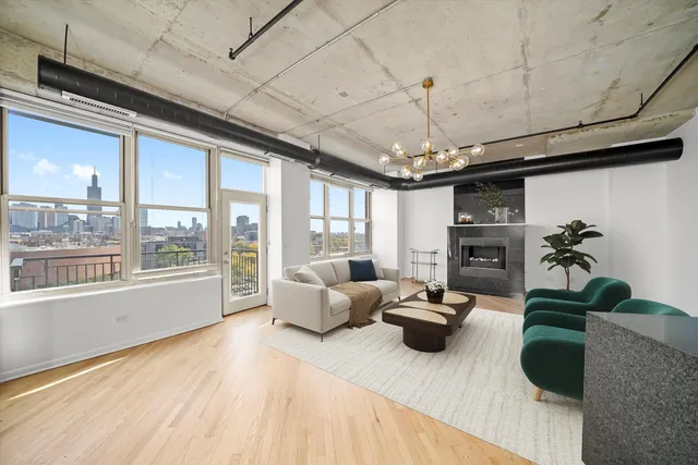 a living room with furniture a flat screen tv and a large window