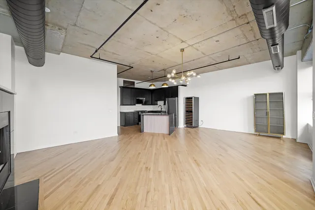 a view of a kitchen with wooden floor