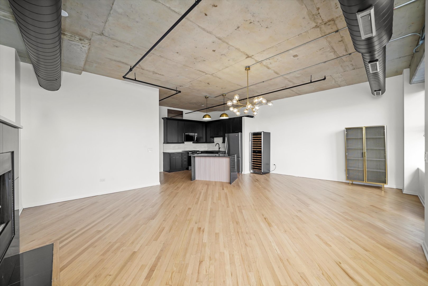 6 South Laflin Street, Unit 910 Chicago, IL 60607 - Photo 8 of 23 a view of a kitchen with wooden floor