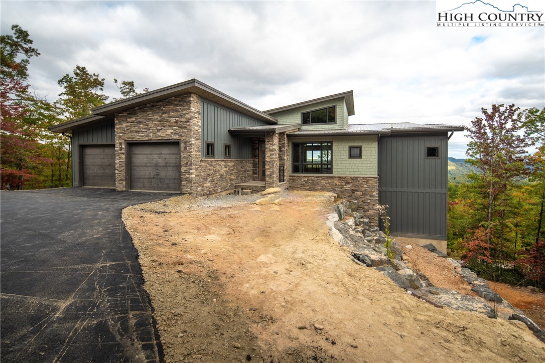 140 Lobelia Lane Boone, NC 28607 - Photo 27 of 31 a house with yard in front of it