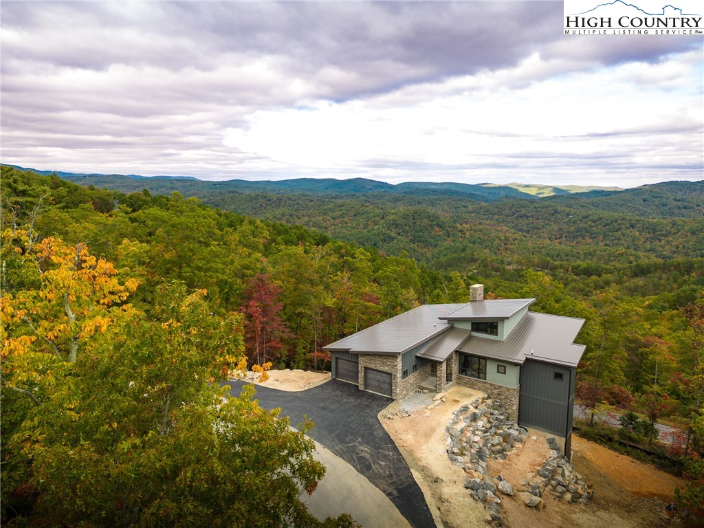 140 Lobelia Lane Boone, NC 28607 - Photo 30 of 31 an aerial view of a house with a garden