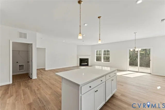 a kitchen with white cabinets stainless steel appliances and sink