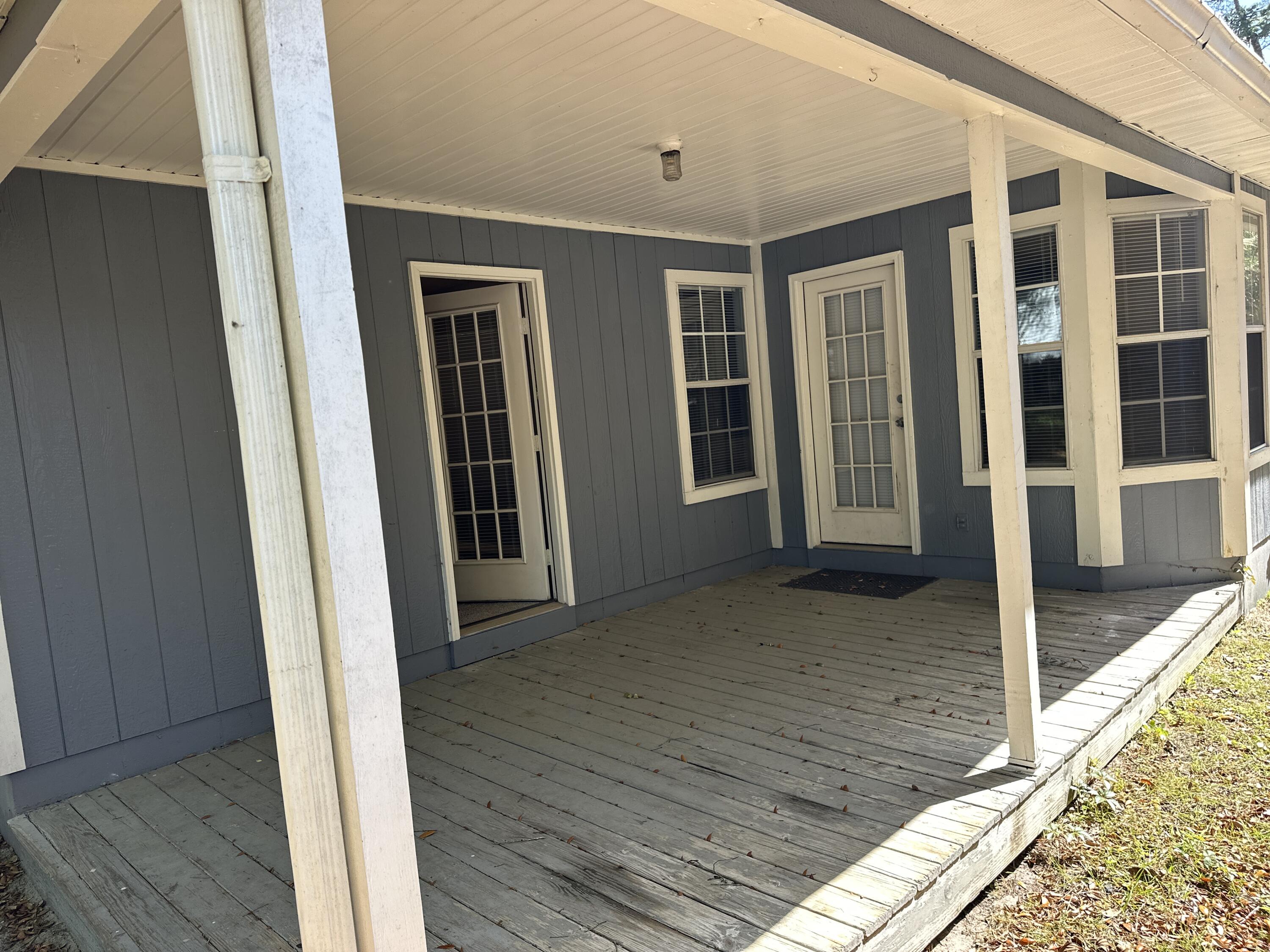 114 Wright Circle Niceville, FL 32578 - Photo 16 of 17 a view of a house with wooden floor
