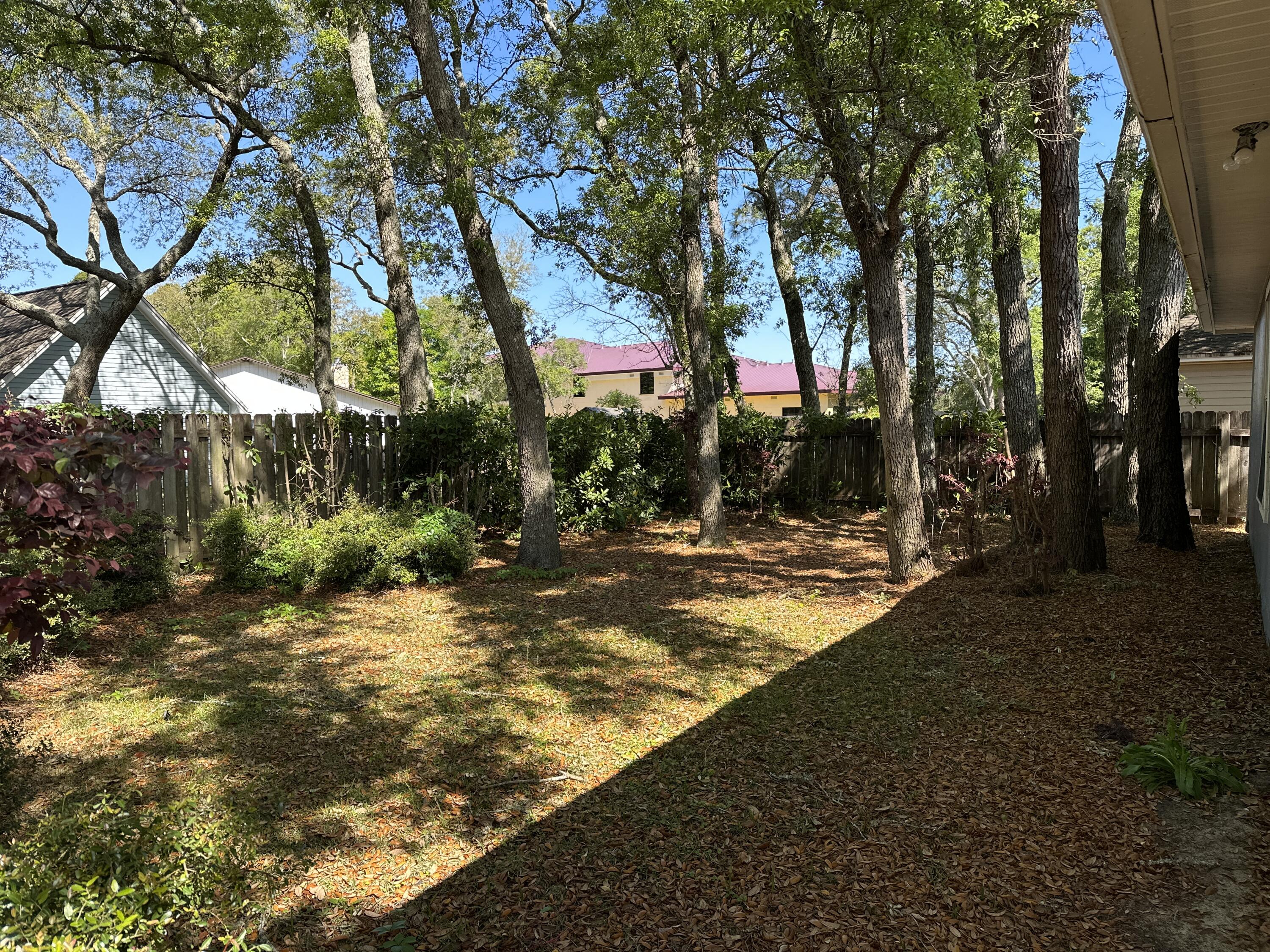 114 Wright Circle Niceville, FL 32578 - Photo 17 of 17 a view of a yard with trees
