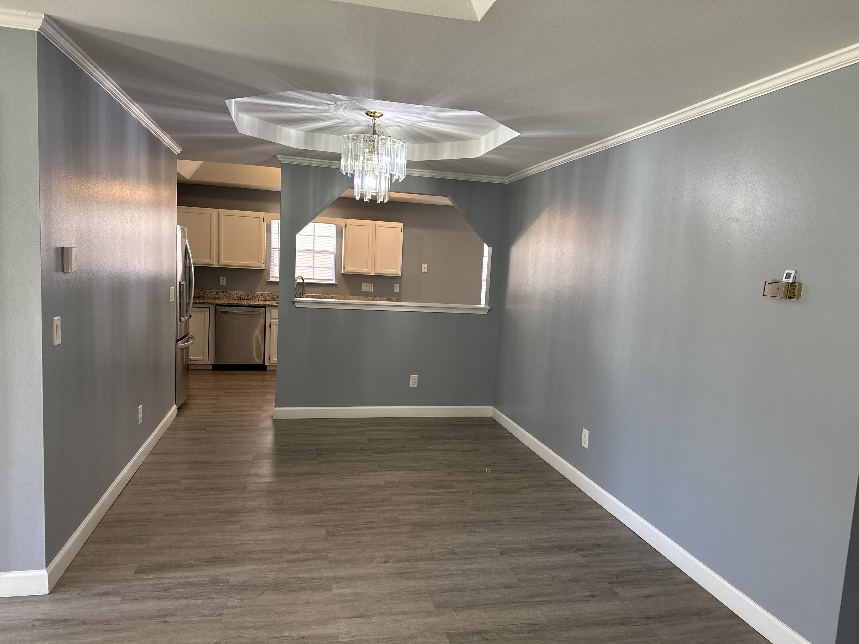 114 Wright Circle Niceville, FL 32578 - Photo 3 of 17 a view of a kitchen with a sink and chandelier