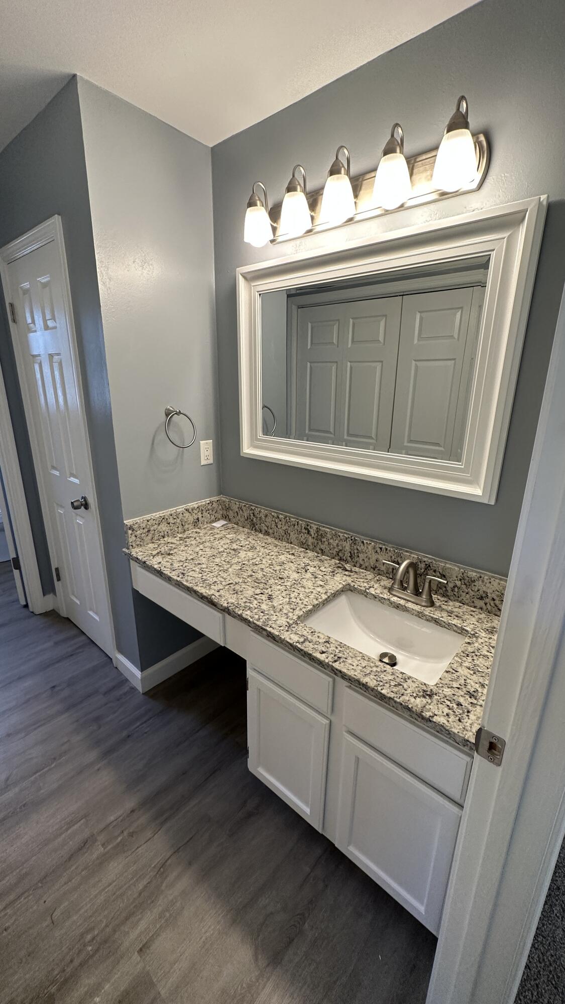 114 Wright Circle Niceville, FL 32578 - Photo 7 of 17 a bathroom with a granite countertop sink and a mirror