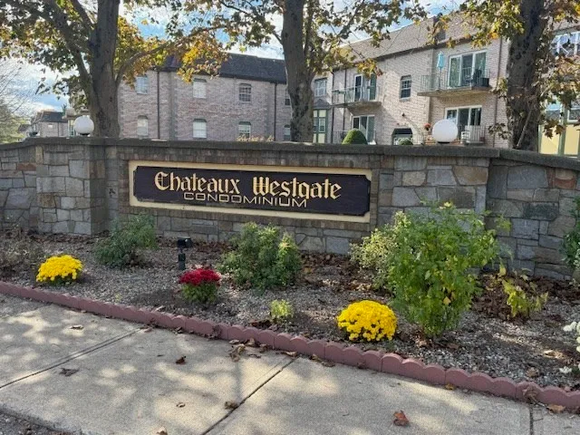 a street sign on a brick wall