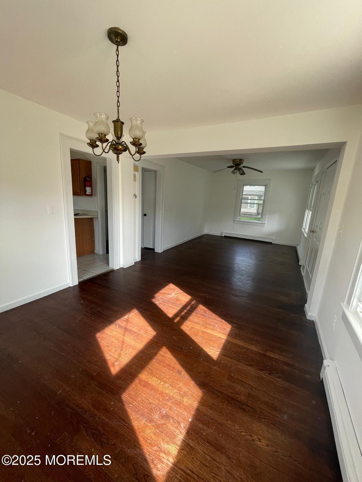 399 Park Avenue, Unit 1 Oakhurst, NJ 07755 - Photo 6 of 12 a view of a room with wooden floor