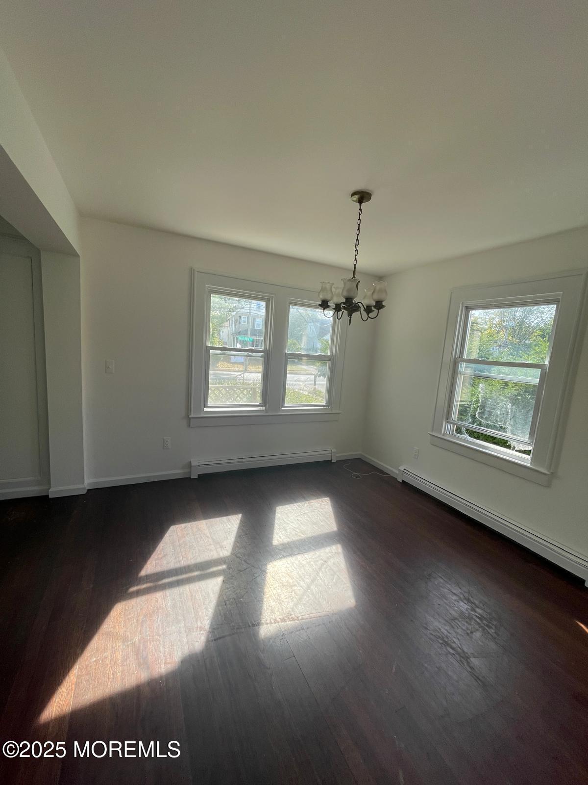 399 Park Avenue, Unit 1 Oakhurst, NJ 07755 - Photo 7 of 12 an empty room with windows