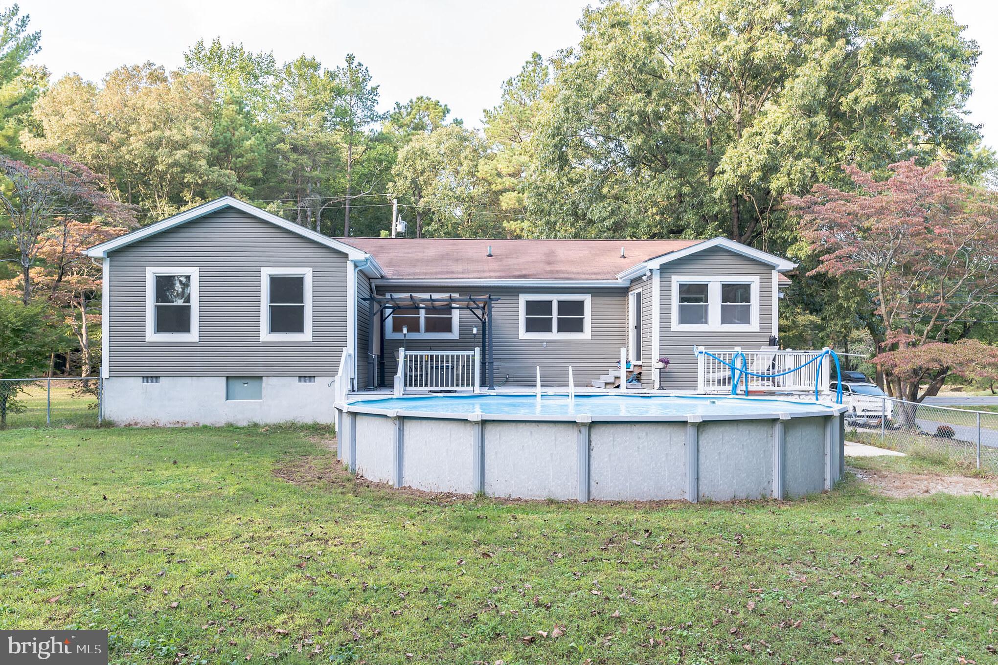 758 Jackson Ditch Road Harrington, DE 19952 - Photo 28 of 33 Backyard with Above Ground Pool