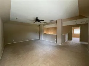 an empty room with a empty space and windows