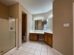 a bathroom with a sink a mirror and a bathtub