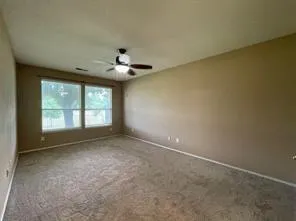 an empty room with a empty space and windows