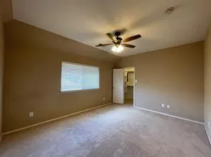 an empty room with a empty space and windows