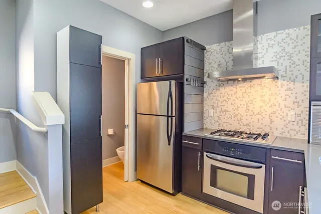 a kitchen with a sink and a refrigerator