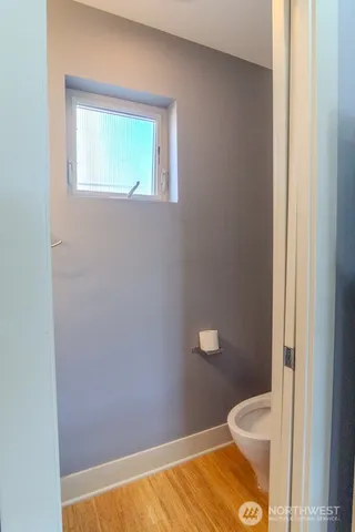 a bathroom with a sink a mirror and a light fixture