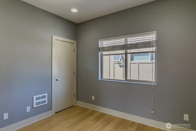 a bathroom with a granite countertop sink a bathtub and a shower