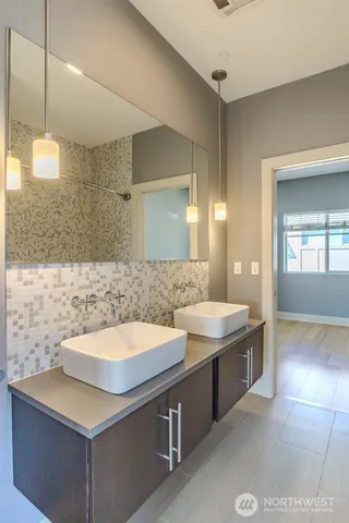 a bathroom with a bathtub and shower