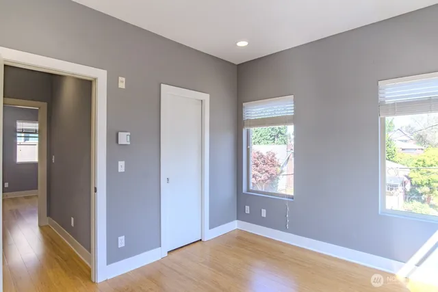 a view of a bedroom with washer and dryer