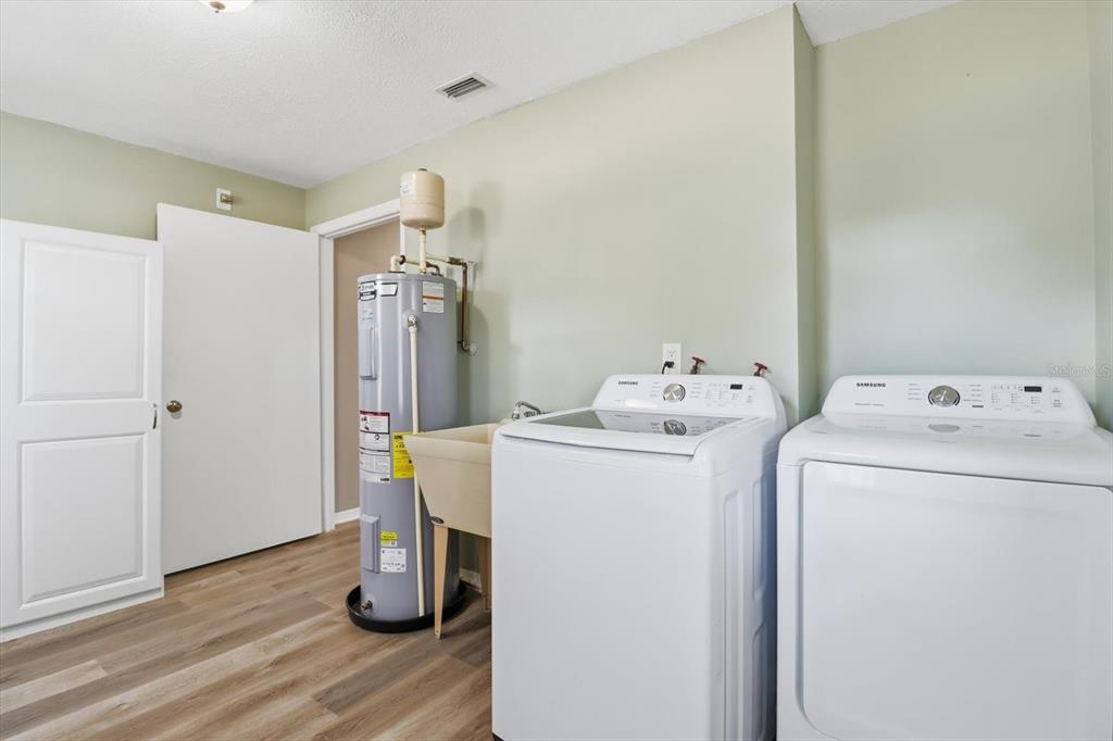 10256 East Pike Drive Inverness, FL 34450 - Photo 27 of 37 a utility room with dryer and washer