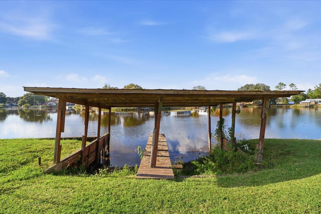 10256 East Pike Drive Inverness, FL 34450 - Photo 32 of 37 an aerial view of a house with garden space and lake view