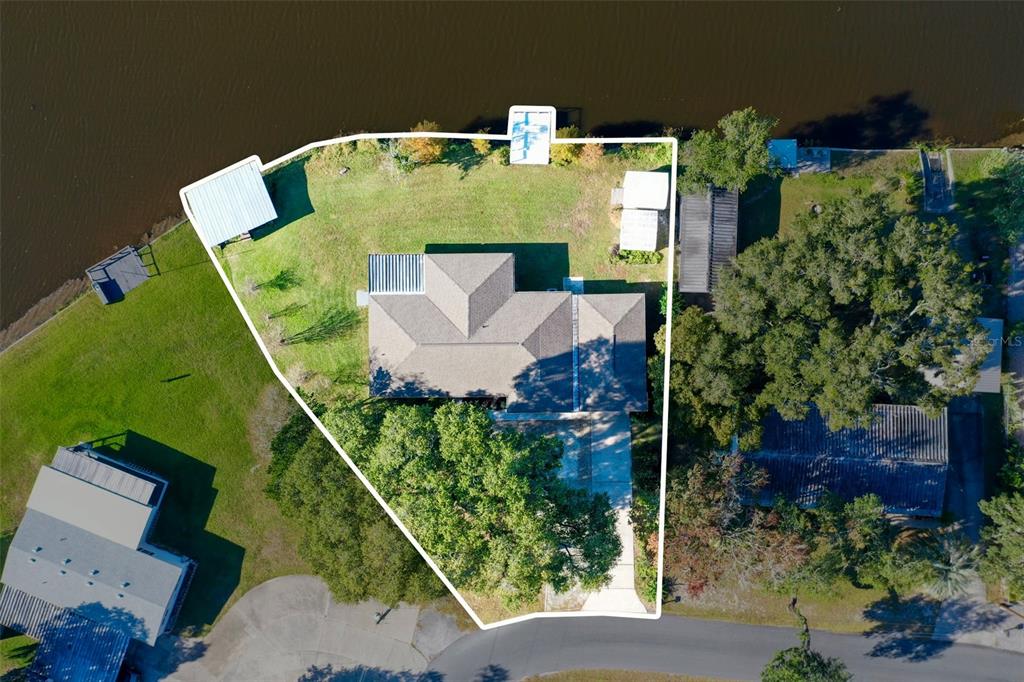 10256 East Pike Drive Inverness, FL 34450 - Photo 34 of 37 an aerial view of a house with pool outdoor seating and green space