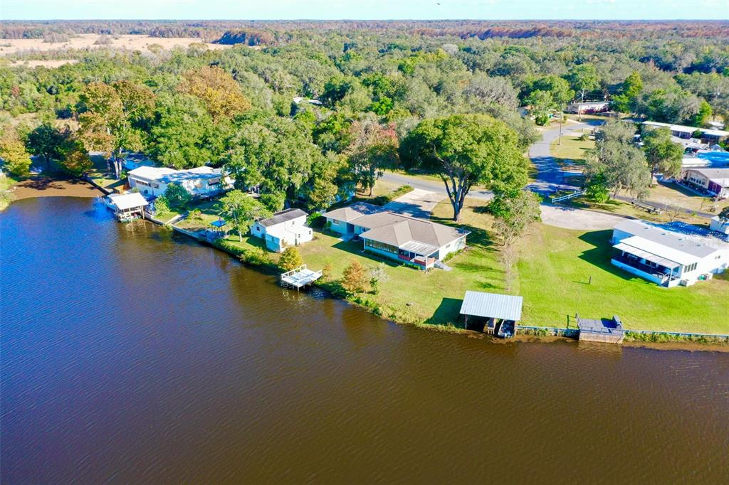 10256 East Pike Drive Inverness, FL 34450 - Photo 37 of 37 an aerial view of a houses with a lake view