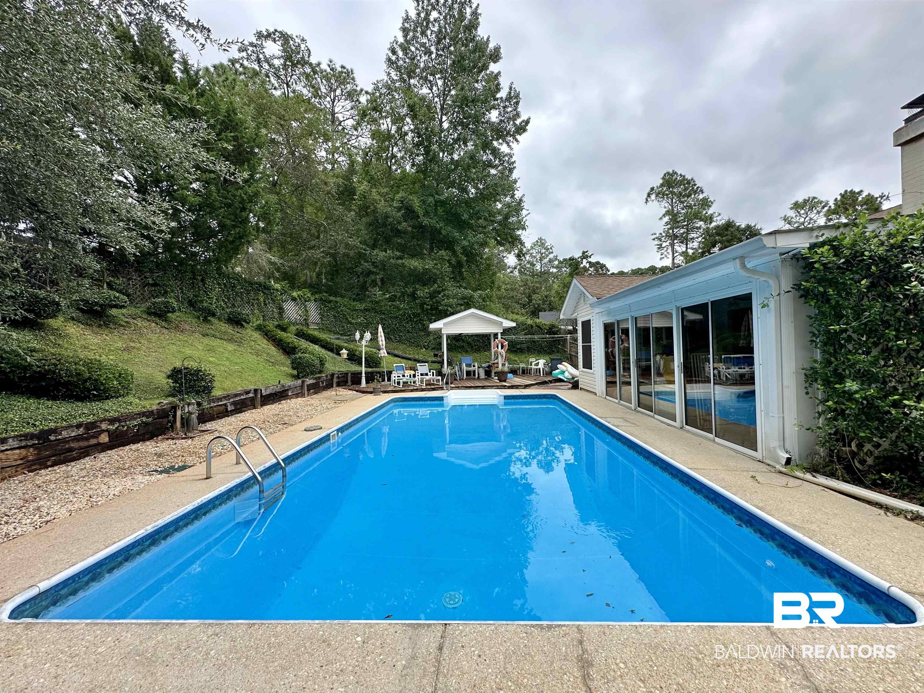 438 Ridgewood Drive Daphne, AL 36526 - Photo 22 of 28 View of swimming pool featuring a patio