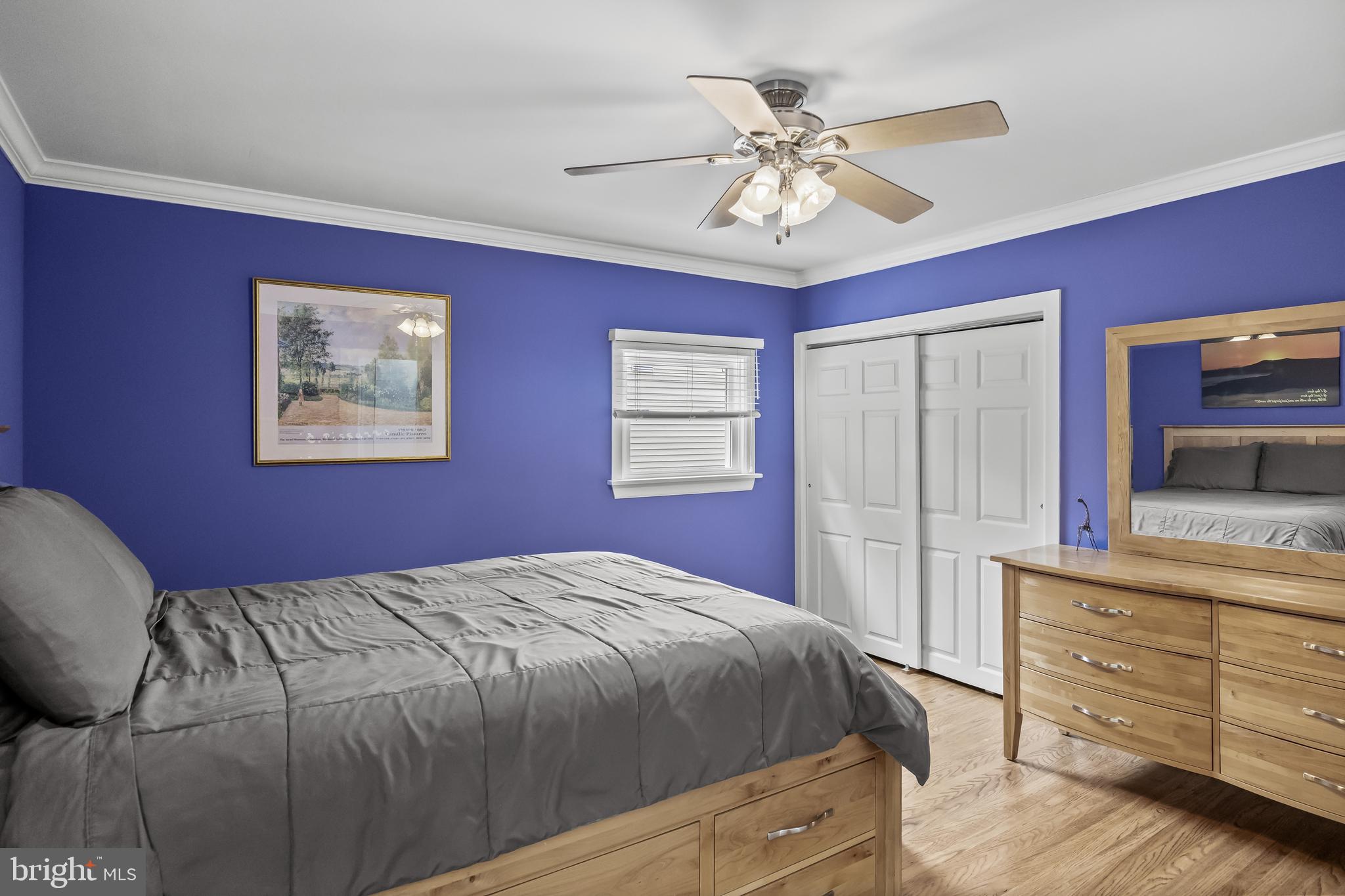 47 Clemson Road Cherry Hill, NJ 08034 - Photo 18 of 50 a bedroom with a large bed and a chandelier