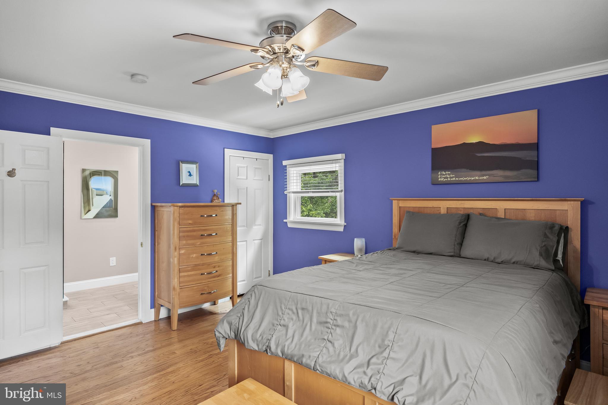 47 Clemson Road Cherry Hill, NJ 08034 - Photo 19 of 50 a bedroom with a large bed and a chandelier