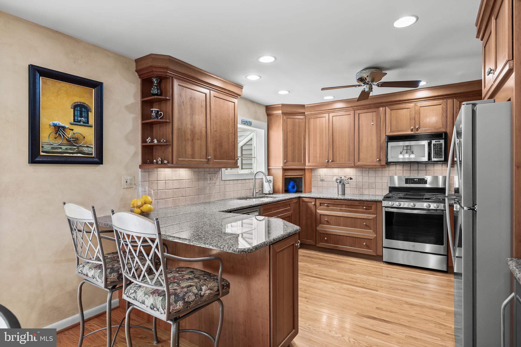 47 Clemson Road Cherry Hill, NJ 08034 - Photo 2 of 50 a kitchen with stainless steel appliances granite countertop a stove top oven a sink a dining table and chairs