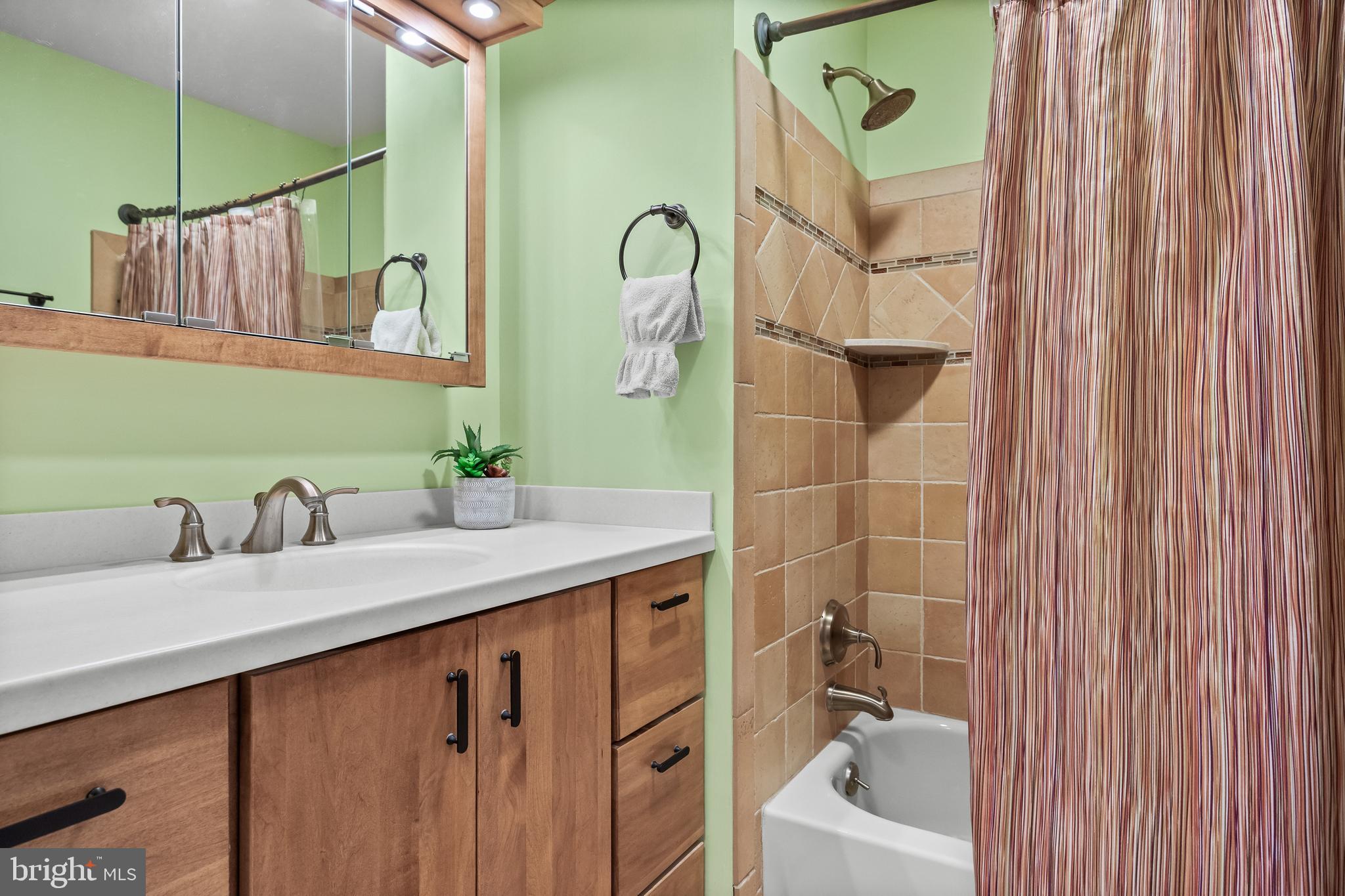 47 Clemson Road Cherry Hill, NJ 08034 - Photo 25 of 50 a bathroom with a sink vanity tub and a mirror